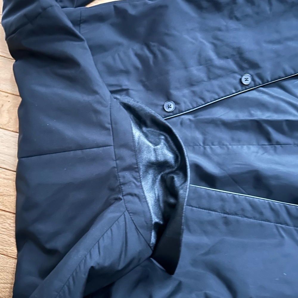 Ann Taylor women’s rain coat button closure  piping and attached belt on back .